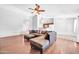 Spacious living room featuring an open layout to the kitchen and stylish furnishings at 10943 W Alice Ave, Peoria, AZ 85345
