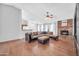 Spacious living room featuring a brick fireplace, hardwood floors, and natural light at 10943 W Alice Ave, Peoria, AZ 85345