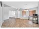 Open living area with tile flooring, neutral paint, and bright natural lighting at 10943 W Alice Ave, Peoria, AZ 85345