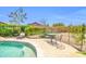 Inviting backyard oasis with a refreshing pool and charming patio furniture for relaxing outdoor living at 10943 W Alice Ave, Peoria, AZ 85345