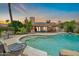 Refreshing pool with seating area perfect for relaxing and enjoying the outdoors at 10943 W Alice Ave, Peoria, AZ 85345