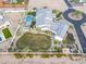 Impressive aerial view of a landscaped property with a pool, spacious lawn, and a circular driveway at 11250 W Prospector Dr, Queen Creek, AZ 85144