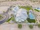 An aerial view of a lovely property showcasing a pool, spa, verdant yard, and a circular driveway at 11250 W Prospector Dr, Queen Creek, AZ 85144