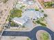 Aerial view of a home with a guest house, pool, desert landscaping and a circular driveway at 11250 W Prospector Dr, Queen Creek, AZ 85144