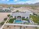 Attractive outdoor features including a pool and spa with expansive outdoor seating and a well-maintained lawn at 11250 W Prospector Dr, Queen Creek, AZ 85144