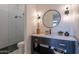 Stylish powder room featuring marble countertop, elegant fixtures, and a glass-enclosed shower at 11250 W Prospector Dr, Queen Creek, AZ 85144