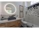 Modern bathroom showcasing hexagon tile shower, marble countertop, and designer lighting and decor at 11250 W Prospector Dr, Queen Creek, AZ 85144