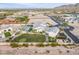 Expansive property featuring a luxurious home, a large yard, mature trees, and a mountain view backdrop at 11250 W Prospector Dr, Queen Creek, AZ 85144