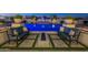 Inviting outdoor space with a modern fire pit, comfortable seating, and a view of the illuminated pool at 11250 W Prospector Dr, Queen Creek, AZ 85144