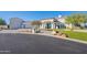 Charming stucco home with manicured lawn and striking desert landscaping, highlighting its curb appeal at 11250 W Prospector Dr, Queen Creek, AZ 85144