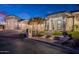 Elegant single-Gathering home with professional landscaping, a three-car garage, and brick accents at 11250 W Prospector Dr, Queen Creek, AZ 85144