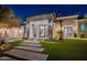 Elegant single-Gathering home featuring professional landscaping and a three-car garage in a desert setting at 11250 W Prospector Dr, Queen Creek, AZ 85144