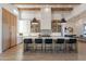 Open-concept kitchen with a spacious island, modern stools, and natural wood accents for a warm, inviting atmosphere at 11250 W Prospector Dr, Queen Creek, AZ 85144