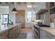 Gourmet kitchen featuring stainless steel appliances, custom cabinets, and a sleek design, perfect for culinary enthusiasts at 11250 W Prospector Dr, Queen Creek, AZ 85144