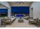Relaxing outdoor patio space with a comfortable seating area and a view of the stunning pool and backyard at 11250 W Prospector Dr, Queen Creek, AZ 85144