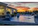 Inviting pool with fountains, luxurious landscaping, and a covered patio area at 11250 W Prospector Dr, Queen Creek, AZ 85144