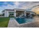 Luxury home showcasing a sparkling pool, outdoor patio, and immaculate landscaping for ultimate relaxation and entertainment at 11250 W Prospector Dr, Queen Creek, AZ 85144