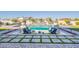 A backyard pool featuring clear glass, modern tile, and desert landscaping creates an oasis at 11250 W Prospector Dr, Queen Creek, AZ 85144