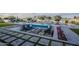 Inviting backyard featuring a pool, fire pit, and a cozy lounge area, perfect for entertaining guests outdoors at 11250 W Prospector Dr, Queen Creek, AZ 85144