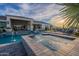 Gorgeous pool and spa with meticulously designed landscaping, perfect for enjoying outdoor leisure and serene sunsets at 11250 W Prospector Dr, Queen Creek, AZ 85144