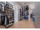 Well-organized walk-in closet featuring custom shelving and rods for shoes, clothes, and accessories at 11250 W Prospector Dr, Queen Creek, AZ 85144