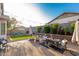 Enjoy the private backyard with brick pavers, fire pit, built-in BBQ, and beautiful string lights at 12062 W Duane Ln, Peoria, AZ 85383