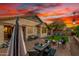 Enjoy the private backyard with brick pavers, fire pit, built-in BBQ, and beautiful string lights at 12062 W Duane Ln, Peoria, AZ 85383