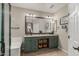 Well-lit bathroom features double sinks, vanity with storage, and a shower with tile floors at 12062 W Duane Ln, Peoria, AZ 85383
