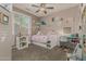 Cozy bedroom with pull-out bed, study desk, and window provides a comfortable and functional space at 12062 W Duane Ln, Peoria, AZ 85383