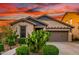 Charming single-story home featuring desert landscaping, a two-car garage and a cozy entrance at 12062 W Duane Ln, Peoria, AZ 85383