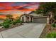 Well maintained house featuring desert landscaping, a driveway, and a two-car garage at 12062 W Duane Ln, Peoria, AZ 85383