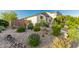 Landscaped front yard featuring xeriscaping with a variety of desert plants and decorative rock at 12062 W Duane Ln, Peoria, AZ 85383