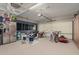 Spacious garage featuring a drum set, bicycles, and ample storage space at 12062 W Duane Ln, Peoria, AZ 85383