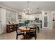 Well-lit kitchen and dining area with pendant lights, a central island, and modern appliances at 12062 W Duane Ln, Peoria, AZ 85383