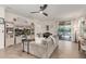 Bright living room boasts tile floors, entertainment center, piano, and sliding doors to a landscaped backyard at 12062 W Duane Ln, Peoria, AZ 85383