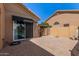Exterior view showcasing brick paver patio with partial view of pool through the rear house windows at 1211 E Desert Flower Ln, Phoenix, AZ 85048
