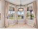 Inviting breakfast nook with backyard views of pool and landscaping at 1211 E Desert Flower Ln, Phoenix, AZ 85048