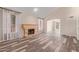 Spacious living room with fireplace and hardwood floors, filled with natural light at 1211 E Desert Flower Ln, Phoenix, AZ 85048