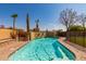 Gorgeous backyard pool with rock waterfall feature, mature trees, and desert landscaping at 1211 E Desert Flower Ln, Phoenix, AZ 85048