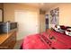 Themed bedroom with a team blanket and a TV on the dresser at 12933 W Monterey Way, Avondale, AZ 85392