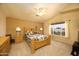 Spacious bedroom with neutral walls, carpet floors, and a ceiling fan offers a relaxing retreat at 12933 W Monterey Way, Avondale, AZ 85392