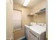 Laundry room with a washer, dryer, shelving, and a window at 12933 W Monterey Way, Avondale, AZ 85392