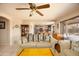 Comfortable living room with couch and decorative pillows, with a glimpse into the kitchen at 12933 W Monterey Way, Avondale, AZ 85392