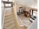 Open loft area with high ceilings overlooking the spacious downstairs living area with carpet at 12933 W Monterey Way, Avondale, AZ 85392