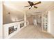 Bright loft space overlooking the living area with a high ceiling and neutral walls at 12933 W Monterey Way, Avondale, AZ 85392