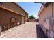 Spacious side yard with rock covering, enclosed by a wall, and access to the house at 12933 W Monterey Way, Avondale, AZ 85392