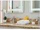 Bathroom featuring double sinks with granite countertop and lit mirrors at 13227 N Mimosa Dr # 101, Fountain Hills, AZ 85268