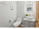 Half bath with bowl sink, granite countertop and hardwood floors at 13227 N Mimosa Dr # 101, Fountain Hills, AZ 85268