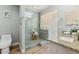 Modern bathroom with glass shower, granite counters, and wood-style flooring at 13227 N Mimosa Dr # 101, Fountain Hills, AZ 85268