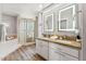 Spacious bathroom with a glass enclosed shower, tub and double granite vanity at 13227 N Mimosa Dr # 101, Fountain Hills, AZ 85268